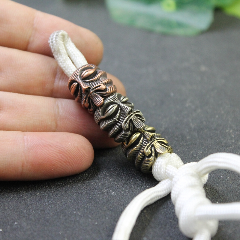 ลูกปัดทองเหลืองลายโทเท็มชาวมาย - Paracord Survival Bracelet บทวิจารณ์และราคา